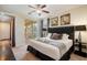 Bedroom with balcony entrance, decorative lamps, and comfortable bed at 7616 Brookhurst Ln, Kissimmee, FL 34747