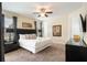 Spacious bedroom with a comfortable bed, a ceiling fan, and natural light from the windows at 7616 Brookhurst Ln, Kissimmee, FL 34747