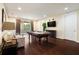 Spacious game room with a pool table, comfortable seating, and a balcony view at 7616 Brookhurst Ln, Kissimmee, FL 34747