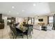 Open concept living space with tile floors, dining area, and kitchen, perfect for entertaining at 7616 Brookhurst Ln, Kissimmee, FL 34747