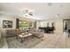 Bright and airy living space with a seamless transition to the dining and outdoor areas with neutral decor at 7616 Brookhurst Ln, Kissimmee, FL 34747
