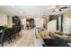 Spacious living room with tile floors, open to the kitchen and dining areas for a seamless flow at 7616 Brookhurst Ln, Kissimmee, FL 34747