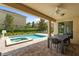 Inviting backyard pool with a spa, surrounded by lush landscaping and patio furniture at 7616 Brookhurst Ln, Kissimmee, FL 34747
