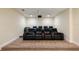 Home theater room equipped with comfortable seating and a projector at 7616 Brookhurst Ln, Kissimmee, FL 34747