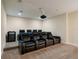 Home theater room equipped with comfortable seating and a projector at 7616 Brookhurst Ln, Kissimmee, FL 34747