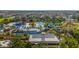 An aerial view of a resort waterpark with various pools and colorful slides, designed for Gathering enjoyment at 7616 Brookhurst Ln, Kissimmee, FL 34747