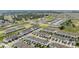 Aerial view highlighting the neighborhood's layout with modern townhomes, green spaces, and convenient road networks at 955 Grandin St, Davenport, FL 33837