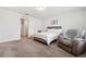 Comfortable bedroom featuring a plush chair, soft bed, and plenty of space at 955 Grandin St, Davenport, FL 33837