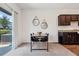 Cozy dining area features a modern table and chairs, and access to the outdoors at 955 Grandin St, Davenport, FL 33837
