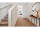Hallway with carpet, staircase, and decorative table at 955 Grandin St, Davenport, FL 33837
