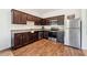 Sleek kitchen featuring stainless steel appliances, granite countertops, and dark cabinetry at 955 Grandin St, Davenport, FL 33837