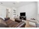 Cozy living room with carpet, stylish furniture, and TV, great for relaxing or entertaining at 955 Grandin St, Davenport, FL 33837