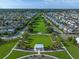 Beautiful aerial view of a residential community featuring green spaces, tree-lined streets, and diverse home styles at 960 Civitas Way, Winter Garden, FL 34787