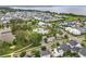 Beautiful aerial view of the community's pool, park, lake, and residences surrounded by mature landscaping at 960 Civitas Way, Winter Garden, FL 34787