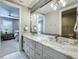 Bathroom featuring a long countertop, cabinets, and a glimpse into the bedroom with coordinated design at 960 Civitas Way, Winter Garden, FL 34787
