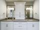 Double sink vanity with quartz countertop and decorative lighting at 960 Civitas Way, Winter Garden, FL 34787