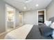 Bedroom featuring ensuite bathroom and walk-in closet, offering convenience and ample storage at 960 Civitas Way, Winter Garden, FL 34787