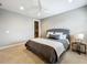 Comfortable bedroom featuring a padded headboard, stylish bedding, and a walk-in closet at 960 Civitas Way, Winter Garden, FL 34787