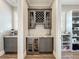 Charming butler's pantry features a wine rack, wine fridge, and ample storage space at 960 Civitas Way, Winter Garden, FL 34787