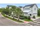 Charming two-story home with well-manicured lawn, a white picket fence and a detached two car garage at 960 Civitas Way, Winter Garden, FL 34787