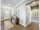 Welcoming foyer with hardwood floors, console table, and neutral paint creates an elegant entrance at 960 Civitas Way, Winter Garden, FL 34787