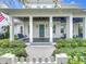 Charming front porch with swing, columns, and landscaping creates curb appeal for this lovely home at 960 Civitas Way, Winter Garden, FL 34787