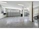 Spacious garage with epoxy flooring, perfect for parking and storage at 960 Civitas Way, Winter Garden, FL 34787