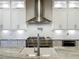 Bright kitchen with stainless steel appliances, white cabinets, and stylish countertops at 960 Civitas Way, Winter Garden, FL 34787