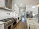 Spacious kitchen featuring stainless appliances, white cabinets, and granite countertops at 960 Civitas Way, Winter Garden, FL 34787