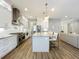 Bright, modern kitchen features a large island, stainless steel appliances, and an open floor plan at 960 Civitas Way, Winter Garden, FL 34787