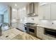 Bright kitchen area with white cabinets, stainless steel appliances, and pot filler faucet at 960 Civitas Way, Winter Garden, FL 34787