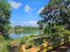 A serene lake view framed by lush greenery and moss-draped trees, creating a tranquil setting at 960 Civitas Way, Winter Garden, FL 34787