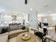 Open-concept living room features hardwood floors, recessed lighting, and flows seamlessly into the adjacent kitchen at 960 Civitas Way, Winter Garden, FL 34787