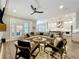 Open living room featuring fireplace, hardwood floors, TV, and comfortable seating area at 960 Civitas Way, Winter Garden, FL 34787