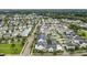 Charming neighborhood street lined with beautiful homes, manicured lawns, and mature trees providing ample shade at 960 Civitas Way, Winter Garden, FL 34787