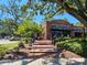 View of Plant Street restaurant, featuring outdoor seating, brick architecture, and lush landscaping at 960 Civitas Way, Winter Garden, FL 34787