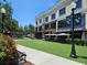 Exterior of Hangry Bison restaurant at a shopping center with outdoor tables, lush grass, and lampposts at 960 Civitas Way, Winter Garden, FL 34787