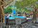 Scenic fountain area in a town center, surrounded by greenery, seating, and vibrant community activity at 960 Civitas Way, Winter Garden, FL 34787