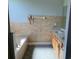 Bathroom featuring a soaking tub, vanity with double sinks and tiled flooring at 9721 Old Patina Way, Orlando, FL 32832