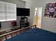 This bedroom is spacious and features a large window that provides natural light at 9721 Old Patina Way, Orlando, FL 32832