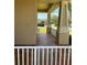 Spacious front porch area with brick tile flooring and decorative columns for relaxed outdoor living at 9721 Old Patina Way, Orlando, FL 32832