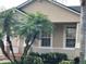 Lovely front porch featuring neutral paint, trim, white railings, and mature palm trees at 9721 Old Patina Way, Orlando, FL 32832
