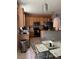 Functional kitchen with stainless steel appliances and a cozy dining area at 9721 Old Patina Way, Orlando, FL 32832