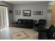 Cozy living room with tile floors, a large window, and comfortable seating at 9721 Old Patina Way, Orlando, FL 32832
