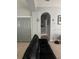Comfortable living room featuring tile floors and a modern gray color palette at 9721 Old Patina Way, Orlando, FL 32832
