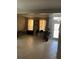 Bright living room with tile floors, large windows, and stylish furnishings at 9721 Old Patina Way, Orlando, FL 32832