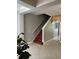 Stairway with wooden steps and a white railing, leading to the upper level at 9721 Old Patina Way, Orlando, FL 32832