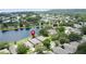 Stunning aerial view of property backing to lake offering serene water views and landscaping at 9824 Secret Cove Ln, Orlando, FL 32832