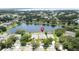 Scenic aerial view of home and surroundings with lush landscaping and water view at 9824 Secret Cove Ln, Orlando, FL 32832