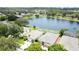 An overhead view of the neighborhood highlighting the large lake and mature trees at 9824 Secret Cove Ln, Orlando, FL 32832